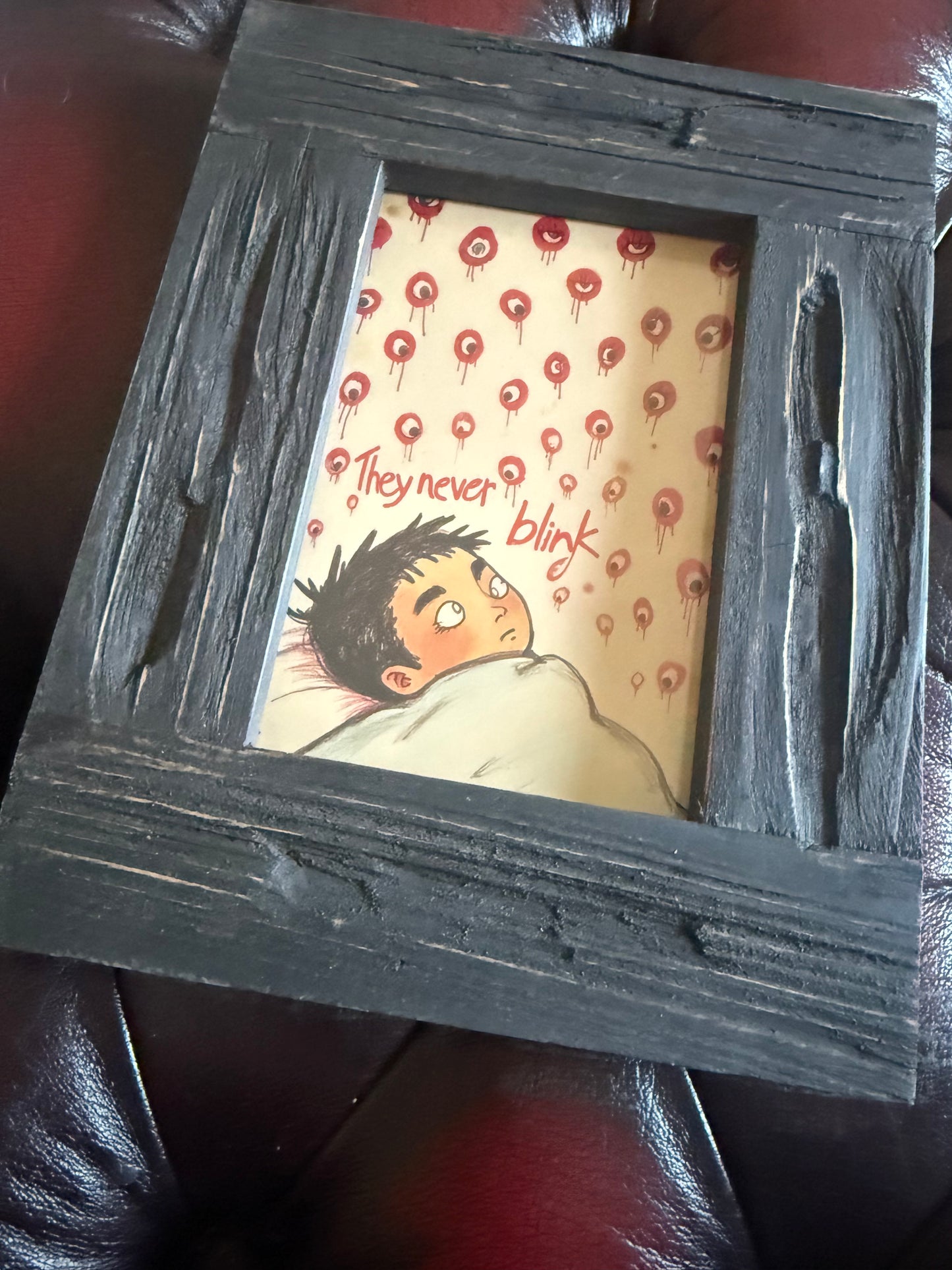 They Never Blink A6 Print in Rustic Wooden Frame
